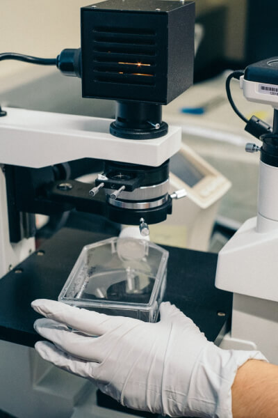 diagnostic-lab-hand-with-glove-holding-tools